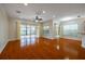 Spacious living area featuring hardwood floors and access to a patio or backyard at 4943 Sandy Brook Cir, Wimauma, FL 33598