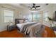 Large main bedroom with hardwood floors and plenty of natural light at 4943 Sandy Brook Cir, Wimauma, FL 33598