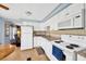 Clean kitchen with white appliances and granite countertops with beige backsplash at 7048 El Meyers St, Zephyrhills, FL 33541