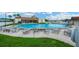 Community pool with plenty of space for lounging and socializing at 7048 El Meyers St, Zephyrhills, FL 33541
