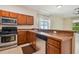 Modern kitchen with stainless steel appliances and ample cabinetry at 6919 Surrey Hill Pl, Apollo Beach, FL 33572