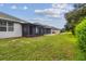 Spacious backyard with screened patio and lush landscaping at 6919 Surrey Hill Pl, Apollo Beach, FL 33572
