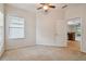 Bedroom with ceiling fan and access to kitchen at 6919 Surrey Hill Pl, Apollo Beach, FL 33572