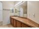 Bathroom with double vanity and large mirror at 6919 Surrey Hill Pl, Apollo Beach, FL 33572