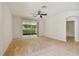 Main bedroom with sliding door to screened patio at 6919 Surrey Hill Pl, Apollo Beach, FL 33572