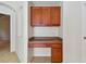 Built-in kitchen desk with extra storage at 6919 Surrey Hill Pl, Apollo Beach, FL 33572