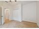 Bedroom with double door closet and carpet flooring at 6919 Surrey Hill Pl, Apollo Beach, FL 33572