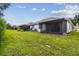 Private backyard with screened patio at 6919 Surrey Hill Pl, Apollo Beach, FL 33572