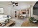 Bright living room features a staged dining area and kitchen at 6919 Surrey Hill Pl, Apollo Beach, FL 33572