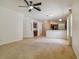 Open living room with views into kitchen area at 6919 Surrey Hill Pl, Apollo Beach, FL 33572