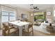 Bright dining room with seating for six and access to living room at 6919 Surrey Hill Pl, Apollo Beach, FL 33572