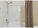 Bathroom with shower/tub combo and curtain at 6919 Surrey Hill Pl, Apollo Beach, FL 33572