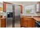 Stainless steel refrigerator in a well-lit kitchen at 6919 Surrey Hill Pl, Apollo Beach, FL 33572