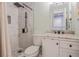 Updated bathroom with marble shower, white vanity, and modern fixtures at 3303 Russett Dr, Tampa, FL 33618