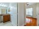 Small bathroom with single vanity and tiled floor at 4943 Sandy Brook Cir, Wimauma, FL 33598