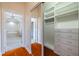 Large walk-in closet with built-in shelves and drawers at 4943 Sandy Brook Cir, Wimauma, FL 33598
