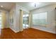 Bright dining area with hardwood floors and sliding glass doors at 4943 Sandy Brook Cir, Wimauma, FL 33598
