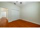 Simple bedroom with hardwood floors and closet at 4943 Sandy Brook Cir, Wimauma, FL 33598