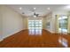 Bright and airy living room with hardwood floors and sliding glass doors at 4943 Sandy Brook Cir, Wimauma, FL 33598