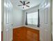 Well-lit bedroom featuring hardwood floors and window coverings at 4943 Sandy Brook Cir, Wimauma, FL 33598