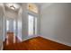 Bright and spacious entryway with hardwood floors and access to other rooms at 4943 Sandy Brook Cir, Wimauma, FL 33598