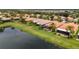 Community view showcasing homes with water access and lush landscaping at 4943 Sandy Brook Cir, Wimauma, FL 33598
