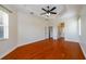 Spacious bedroom with hardwood floors and ceiling fan at 4943 Sandy Brook Cir, Wimauma, FL 33598