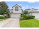 Two-story townhome with attached garage and manicured lawn at 1034 Bella Vista Ne Dr, St Petersburg, FL 33702