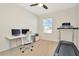 Home office with standing desk and treadmill at 121 Lacewing Pl, Valrico, FL 33594