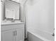 This well-lit bathroom features a vanity with storage and a shower with bathtub at 2510 W Cleveland St # 2, Tampa, FL 33609