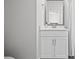 Well-lit bathroom featuring vanity with storage and a mirror, next to the shower and bathtub at 2510 W Cleveland St # 2, Tampa, FL 33609