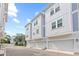 Three-story townhouses with modern, neutral-toned exteriors at 2510 W Cleveland St # 2, Tampa, FL 33609