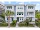 Charming townhome featuring a modern facade, lush landscaping, and inviting outdoor spaces at 2510 W Cleveland St # 2, Tampa, FL 33609
