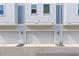 Attached townhouse garage featuring modern, neutral facade at 2510 W Cleveland St # 2, Tampa, FL 33609
