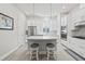 Modern kitchen featuring stainless steel appliances, a center island with seating, and ample cabinet space at 2510 W Cleveland St # 2, Tampa, FL 33609