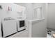 Efficient laundry room featuring modern washer and dryer at 2510 W Cleveland St # 2, Tampa, FL 33609