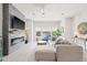 Modern living room features a cozy fireplace, ample natural light, and stylish decor at 2510 W Cleveland St # 2, Tampa, FL 33609