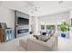 Elegant living room features a cozy fireplace, ample natural light, and stylish decor at 2510 W Cleveland St # 2, Tampa, FL 33609