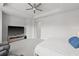 Spacious main bedroom features tray ceilings, ceiling fan, media center, and neutral carpeting at 2510 W Cleveland St # 2, Tampa, FL 33609