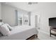 Light-filled main bedroom showcases a comfortable bed and an ensuite bathroom at 2510 W Cleveland St # 2, Tampa, FL 33609