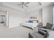 Spacious main bedroom features tray ceilings, ceiling fan, sitting area, large windows, and neutral carpeting at 2510 W Cleveland St # 2, Tampa, FL 33609