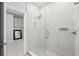 The walk-in shower features white tile, a glass enclosure, and is accessible to the walk-in closet at 2510 W Cleveland St # 2, Tampa, FL 33609