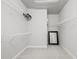 Spacious walk-in closet with carpet flooring, multiple shelves, and a framed mirror at 2510 W Cleveland St # 2, Tampa, FL 33609