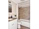 Bathroom features vanity, toilet, and shower-tub combination with modern fixtures and neutral tones at 3245 Bigelow Dr Dr, Holiday, FL 34691