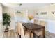 Cozy dining space with wood-look flooring, elegant accents, and plenty of natural light at 3245 Bigelow Dr Dr, Holiday, FL 34691