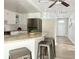 Bright kitchen featuring white cabinets, granite countertops, and stainless steel appliances at 3245 Bigelow Dr Dr, Holiday, FL 34691