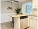 Modern kitchen with stainless steel appliances, granite counters, and a breakfast bar for casual dining at 3245 Bigelow Dr Dr, Holiday, FL 34691