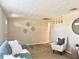 Bright living room showcasing wood-look floors, comfortable seating, and decorative accents at 3245 Bigelow Dr Dr, Holiday, FL 34691