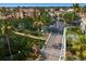 Aerial view of a gated community near the water, complete with a pool and a canal lined with boats at 5000 Culbreath Key Way # 4-306, Tampa, FL 33611