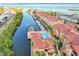 Stunning aerial view showcasing the waterfront condos, boat docks, and beautiful community pool at 5000 Culbreath Key Way # 4-306, Tampa, FL 33611